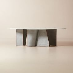 Inspired by high-end custom metalwork, the tonal mixed-material look of the Bretagne oval dining table by goop highlights the refined materiality of cast aluminum and milky white resin. A modern interpretation of Brutalist design, satin cast aluminum legs are accented with a pale copper finish on the edges that evokes the soft patina of oxidized metal. The legs meet at unexpected angles, bringing new energy to the piece from every angle. Evoking the signature style of goop, the resin top is coat White Wood Furniture, Gold Furniture, Brutalist Design, Resin Top, Ceramic Dinnerware Set, Oval Dining Table, Rattan Dining Chairs, Metal Dining Table, Marble Dining