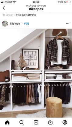 an image of a closet with clothes on shelves