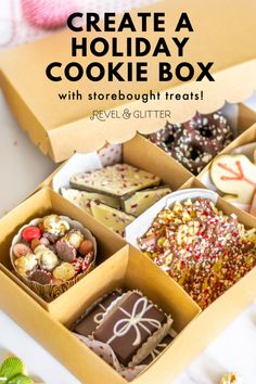 an open box filled with lots of different types of cookies and candies on top of a table