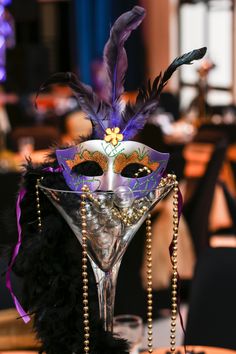 a poster for mardi gras nola with a mask on it's face