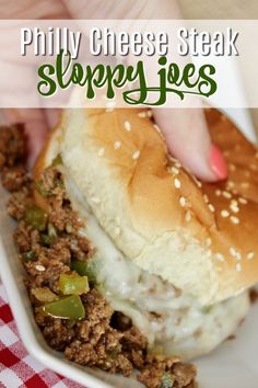 a close up of a sandwich on a plate with text overlay that reads, phily cheese steak sloppy joes