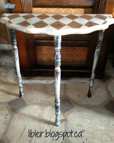 an old table is painted white and has been turned into a checkerboard design