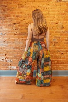 "Gorgeous handmade wide leg pants! Bohemian grunge feel with incredible intricate patchwork detail! Side pockets and 3 gorgeous colors. 2 sizes available Fit details Regular - 24-38\" waists, 28\" inseam Plus - 38-58\" waists, 28\" inseam" Hippie Wide Leg Patchwork Pants, Hippie Wide-leg Patchwork Pants, Bohemian Multicolor Wide Leg Pants, Bohemian Wide Leg Bottoms With Patchwork, Bohemian Cotton Pants With Floral Patchwork, Multicolor Bohemian Pants With Boho Print, Multicolor Cotton Wide Leg Hippie Pants, Vintage Wide Leg Patchwork Pants, Multicolor Patchwork Wide Leg Harem Pants