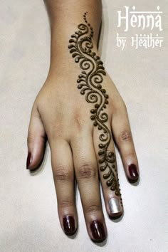 henna tattoo on the palm of a woman's hand