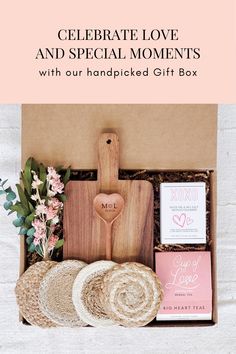 a wooden cutting board with flowers and other items in it