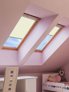 there are two skylights above the bed in this child's room with pink walls