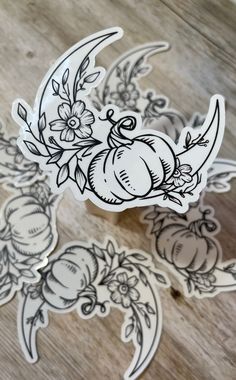 some stickers with flowers and pumpkins on them