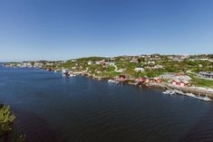 an aerial view of a small town on the water