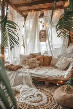 a room with lots of pillows and plants in it