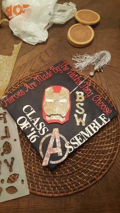 a graduation cap is sitting on a table with other decorations and paper machs around it