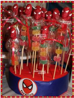 spiderman lollipops are arranged on sticks