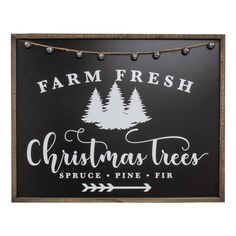 a sign that says farm fresh christmas trees, spruce pine fir and arrow on it