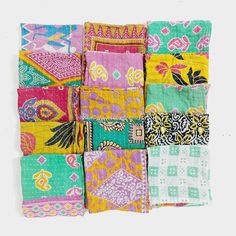 an assortment of different colored bandannas on a white background