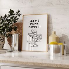 a framed poster on a shelf next to a potted plant and vases with lemons