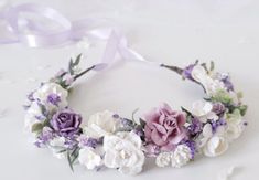 a flower crown with purple and white flowers