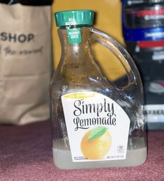 a bottle of lemonade sitting on top of a table