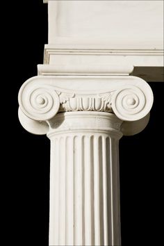 an old white column against a black background