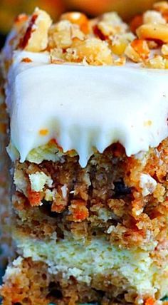 a piece of carrot cake with white frosting