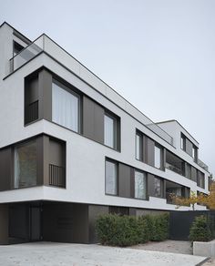 an apartment building with multiple balconies and windows