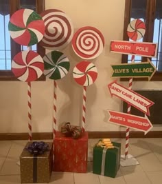 some candy canes and signs are on display