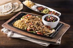 an assortment of mexican food on a tray