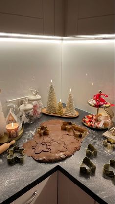 a kitchen counter topped with lots of cookies and other holiday treats on top of it