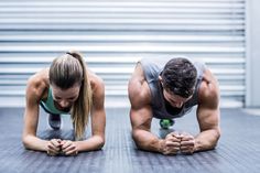 two people doing push ups on the ground