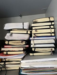 many books are stacked on top of each other