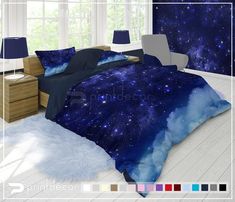 a bed room with a neatly made bed and two night sky themed pillows on it