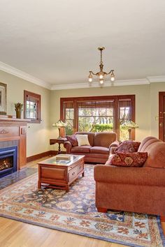 a living room filled with furniture and a fire place