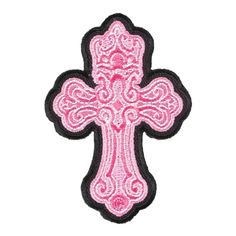 a pink and black cross with intricate designs on the front, embroidered onto it's back