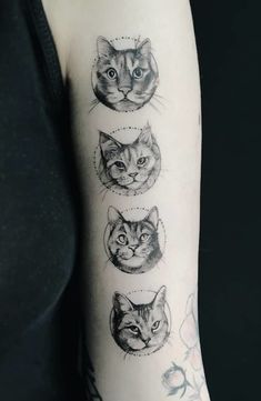 a woman's arm with four different cats on the left side of her arm