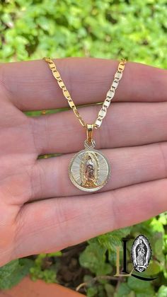 Celebrate faith and elegance with our Virgen de Guadalupe Necklace. This stunning piece features a pendant with a Diamond Cut design. The intricate craftsmanship highlights the revered Virgen de Guadalupe in a strikingly modern way.  PRODUCT DETAILS * Material: 14K Gold Filled * Metal Purity: 14K * Chain Size: 14" 16" 18" and 20" Inches * Chain Thickness: 2.8mm * Pendant Size: 18x15mm * Chain Style: Valentino Link * Gender: Unisex * Clasp Type: Lobster Claw * Age Group: All Ages * Condition: 100 Guadalupe Necklace, Newark Nj, Our Lady Of Guadalupe, Lady Of Guadalupe, Our Lady, Cut Design, Chain Styles, Wedding Shop, Free Gifts