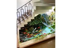 a fish pond in the middle of a stair case