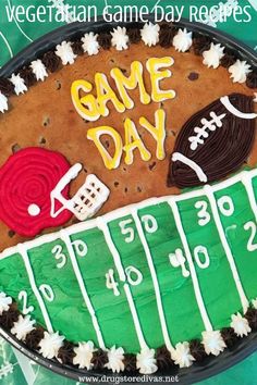 a football field cake with the words game day written on it and some sports related items