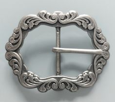 a silver belt buckle on a white background