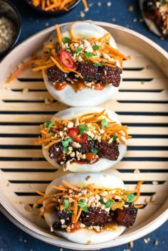 three deviled eggs topped with toppings in a bowl