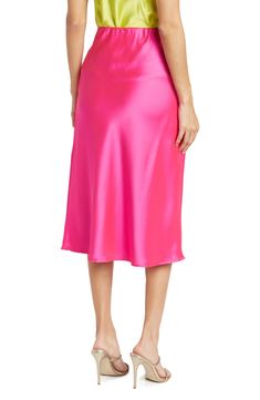 Elevate your wardrobe with this pull-on bias satin midi skirt for elegant, feminine style. 31" length (size S) Elasticized waist Pull-on style Satin construction 97% polyester, 3% spandex Machine wash cold, line dry Made in USA Model’s stats for sizing: 5’10” height, 34” bust, 27” waist, 35” hips. Model is wearing size S. Pink Satin Skirt For Spring, Pink Satin Evening Bottoms, Feminine Pink Satin Bottoms, Pink Satin Lined Skirt Bottoms, Spring Pink Satin Bottoms, Chic Pink Satin Bottoms, Elegant Pink Satin Bottoms, Elegant Pink Satin Skirt, Spring Satin Midi Bottoms