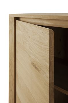 a close up view of a wooden cabinet with its doors open and wood grains on the bottom