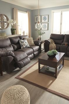 a living room with two couches and a coffee table