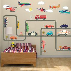 a child's bedroom with cars and planes on the wall