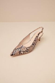 From the office halls to happy hour fun, the Lulus Fosette Brown Snake Pointed-Toe Slingback Pumps are ready to strut through it all! These ultra-chic pumps have a snake-embossed, faux leather construction that shapes a pointed-toe upper and a low-cut collar that flows into a classic slingback strap with a little gold buckle. Flirty kitten-style heel completes the versatile look! 2" wrapped spool heel. Cushioned insole. Rubber sole has nonskid markings. Man made materials. Imported. Lulus | Fose Fitted Slingback Pumps With 4-inch Heel And Pointed Toe, Pointed Toe Snake Print Heels For Party, Snake Print Heels With Pointed Toe, Snake Print Pointed Toe Party Heels, Slingback Kitten Heels, Homecoming Shoes, Brown Snake, Spool Heel, Leopard Print Heels With Pointed Toe And 4-inch Heel