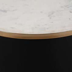 The York Coffee Table is an exquisitely crafted amalgam of metal, marble, and high-quality manufactured wood. Its modern design can be seen in its chunky cylinder shape and black iron base, balanced by a striking white top. Elegant and sophisticated, it is an eye-catching piece that adds a touch of timeless luxury to any living space. Dimensions: L 31" x 31" W x 17" H Coffee Table Frame, Pedestal Coffee Table, Round Coffee Table Modern, Metal Cylinder, Coffee Table Black, Drum Coffee Table, Entry Tables, Table Frame, Metal Coffee Table