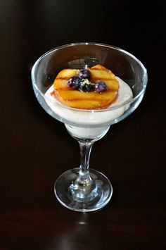 a dessert in a glass bowl on a table