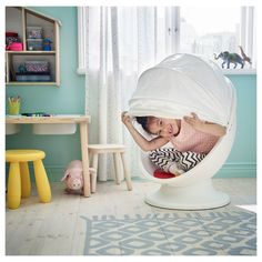 IKEA PS LÖMSK swivel chair, white/red, Width: 23 1/4 ". Round and round you go! Your child sets the pace – spinning slowly relaxes; spinning quickly develops balance. When your child pulls down the hood, it becomes a cozy hideaway. Fabric: 100 %polyester. Ikea Egg Chair, Sensory Space, Ikea Armchair, Little Bedroom, Ikea Canada, Pod Chair, Kids Armchair, Ikea Kids, Cosy Spaces