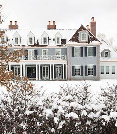 the instagram page on instagram shows an image of a large white house with black shutters