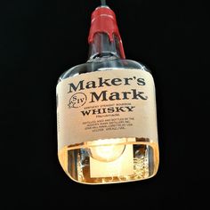 a light that is on top of a black surface with the words maker's mark written on it