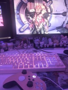 a video game controller sitting in front of a computer screen with the image of an anime character on it