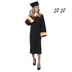 a woman wearing a black and gold graduation gown with paw prints on the floor behind her