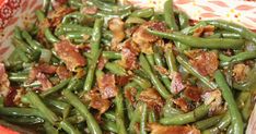 green beans with bacon in a red and white bowl